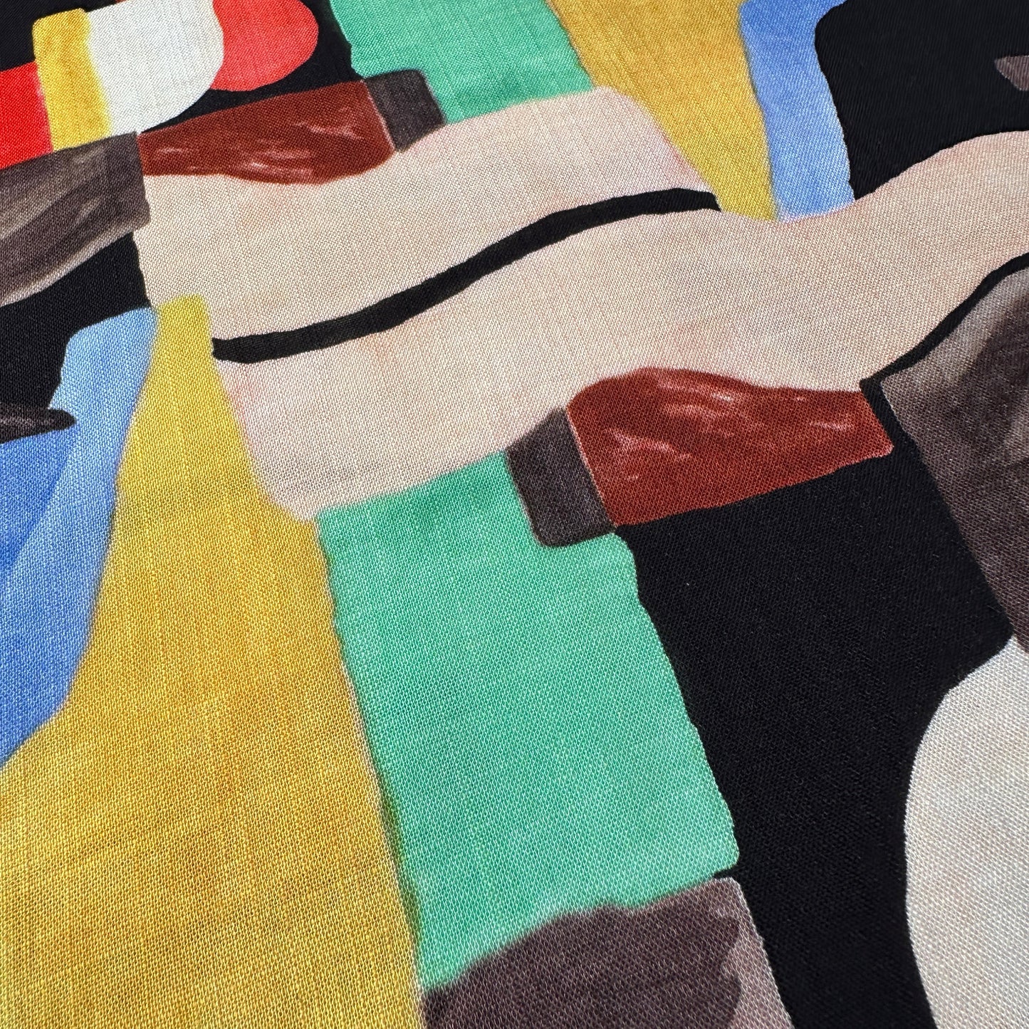 Geometric shapes in various colours on a textured viscose fabric