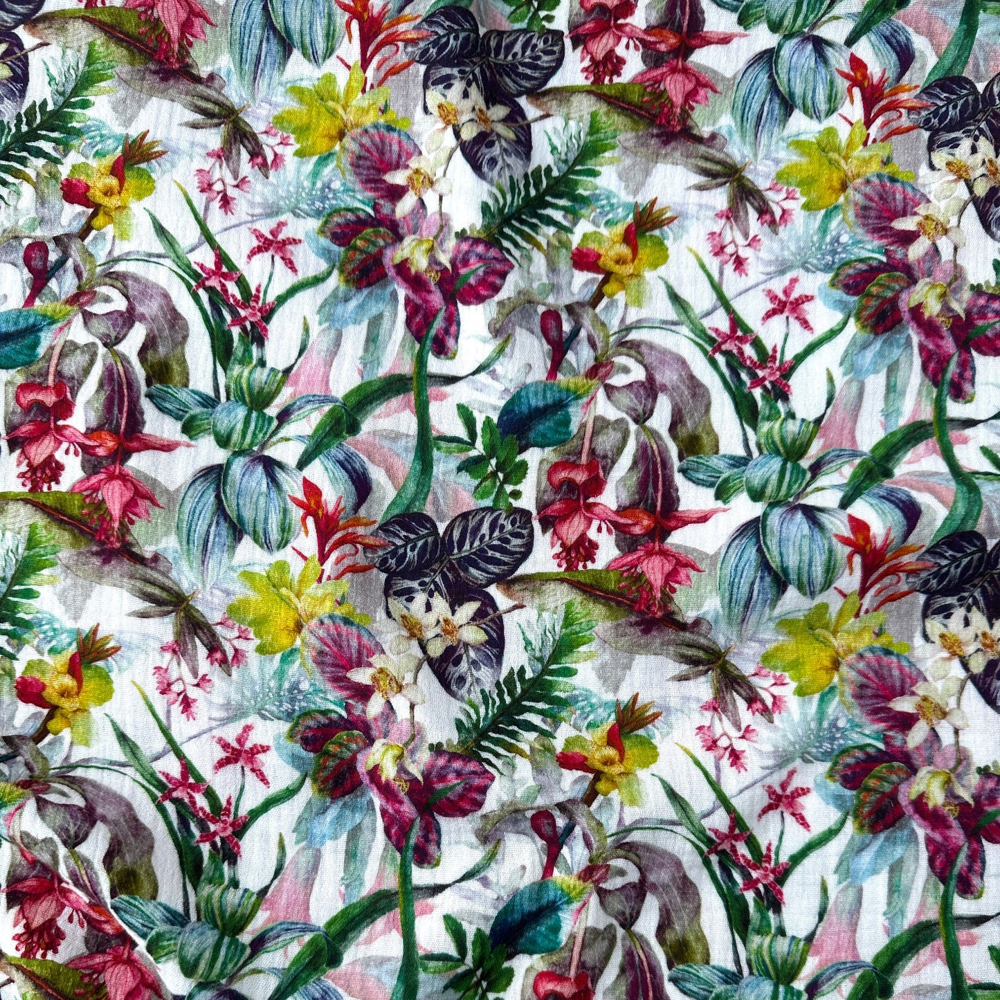 Colourful floral pattern on a white double gauze fabric