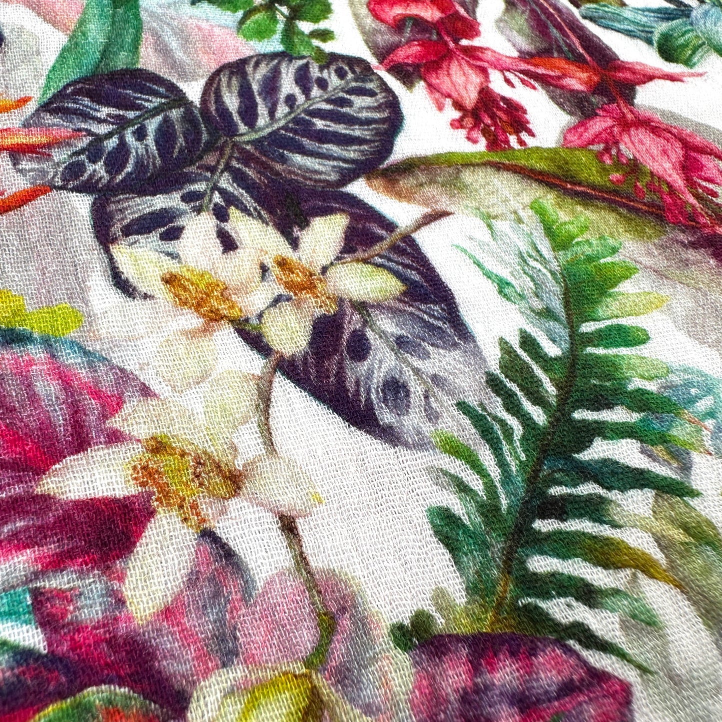Close up of flowers and leaves on a double gauze fabric