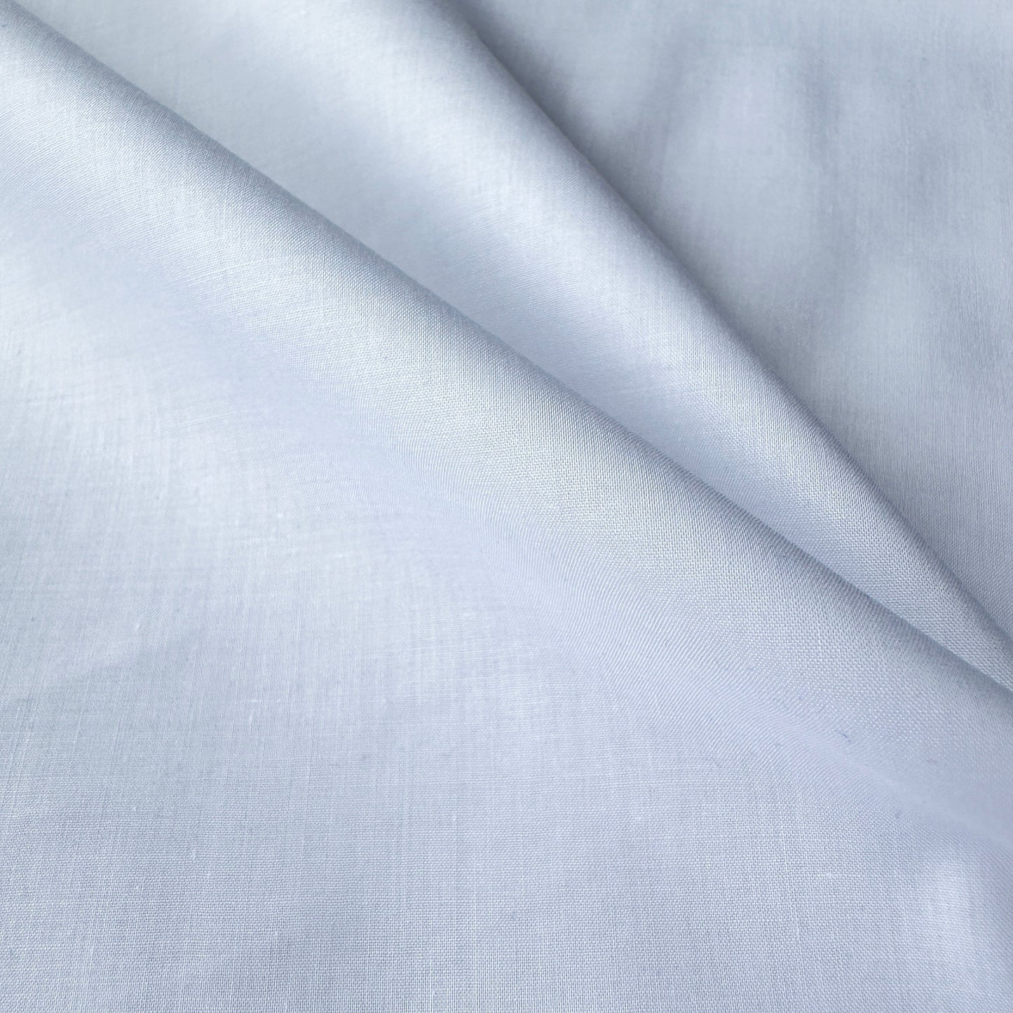Close up of supima pima cotton lawn fabric in white