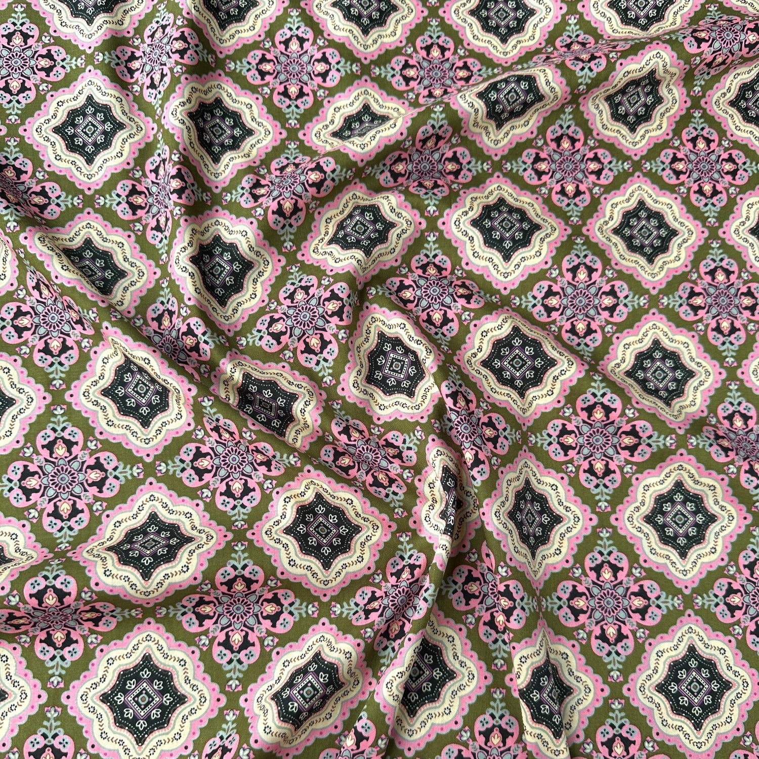 Pima cotton lawn dressmaking fabric with a modern tile design in pinks and greens across it