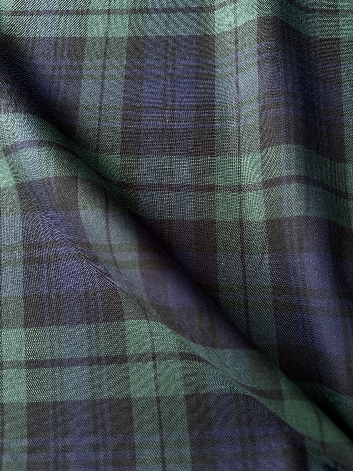 A close-up of draped Black Watch Tartan fabric