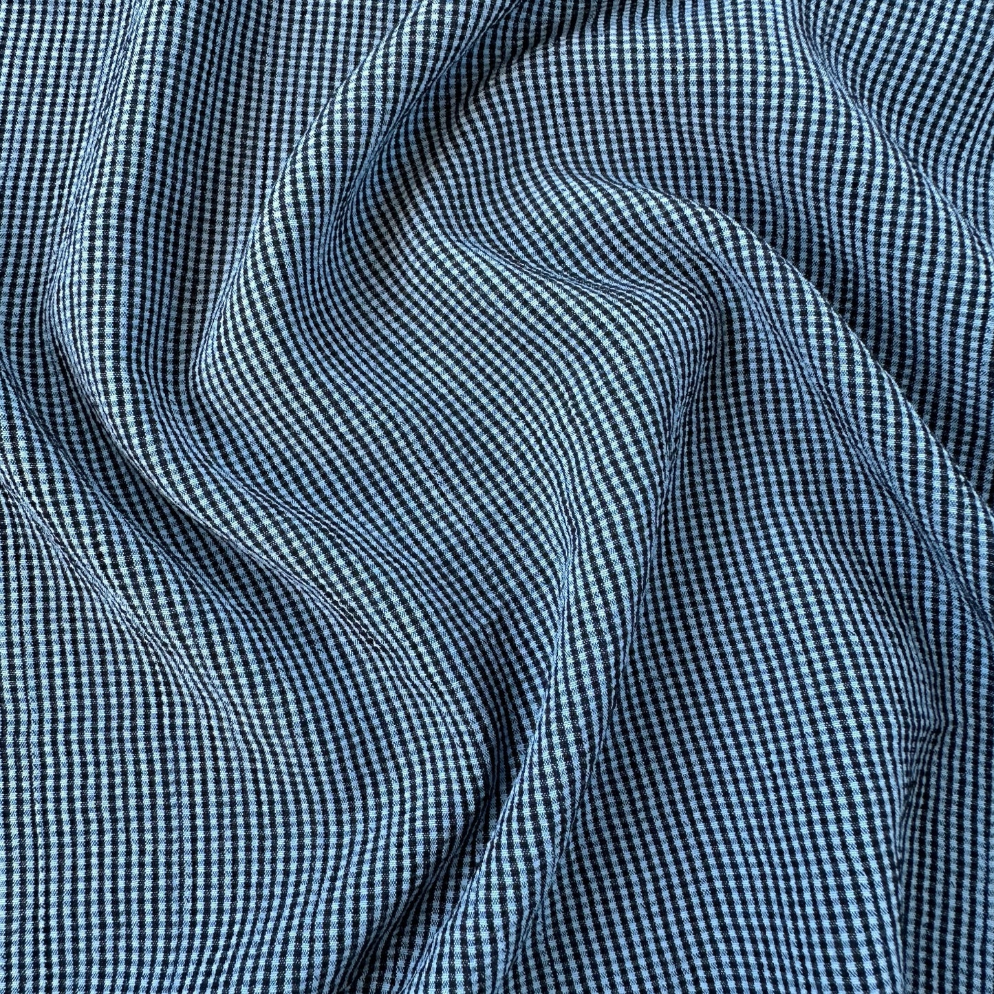 Crinkly blue and navy gingham fabric