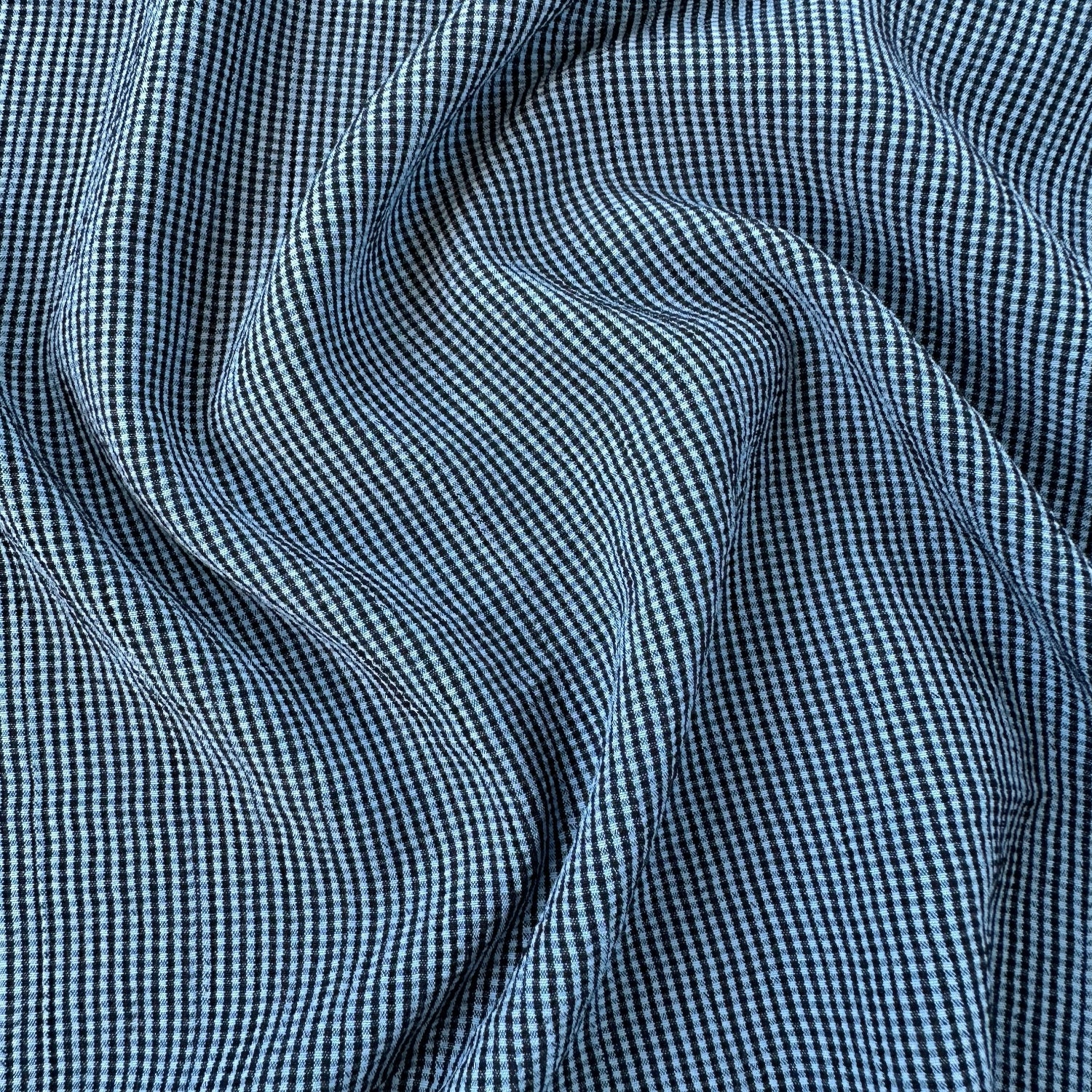 Crinkly blue and navy gingham fabric