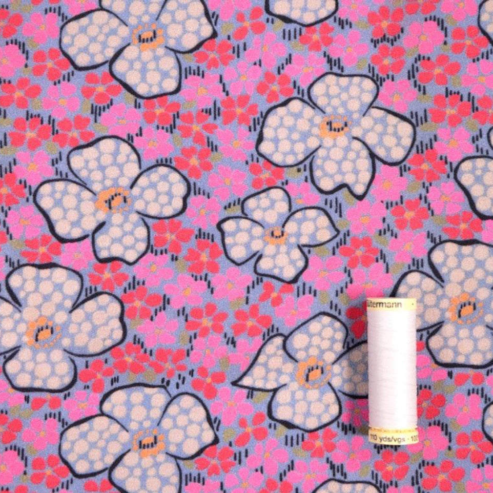 Floral Pink Viscose Crepe Fabric With Reel of Thread for Scale