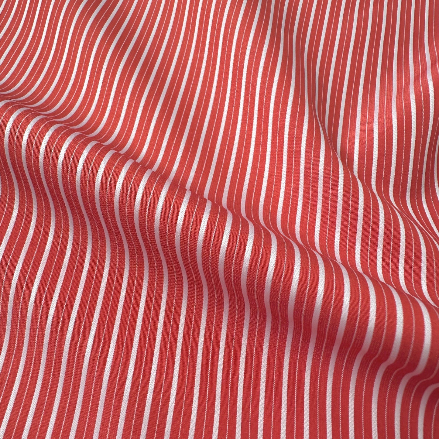 Coral and white striped fabric texture