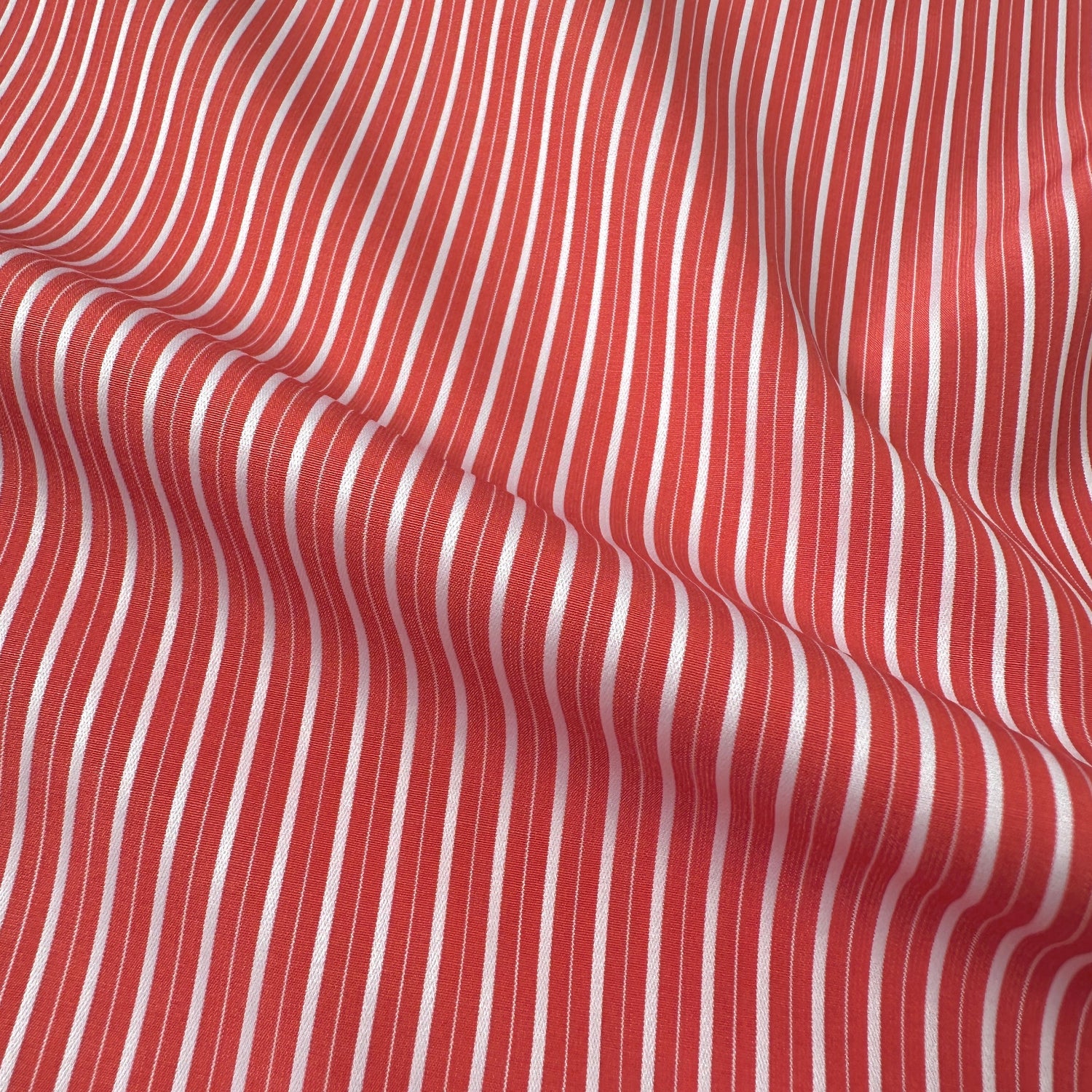 Coral and white striped fabric texture
