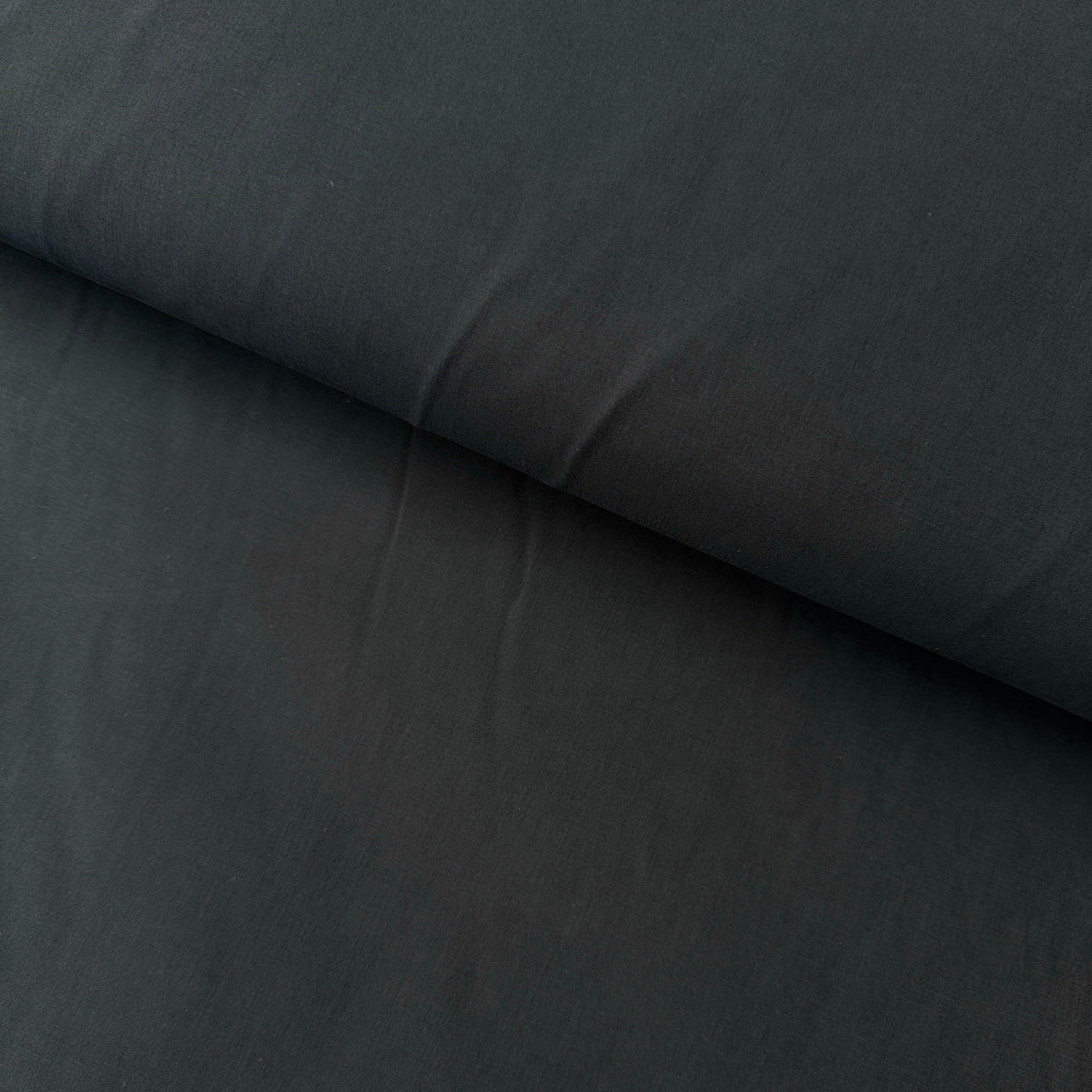 A close-up of a dark navy fabric