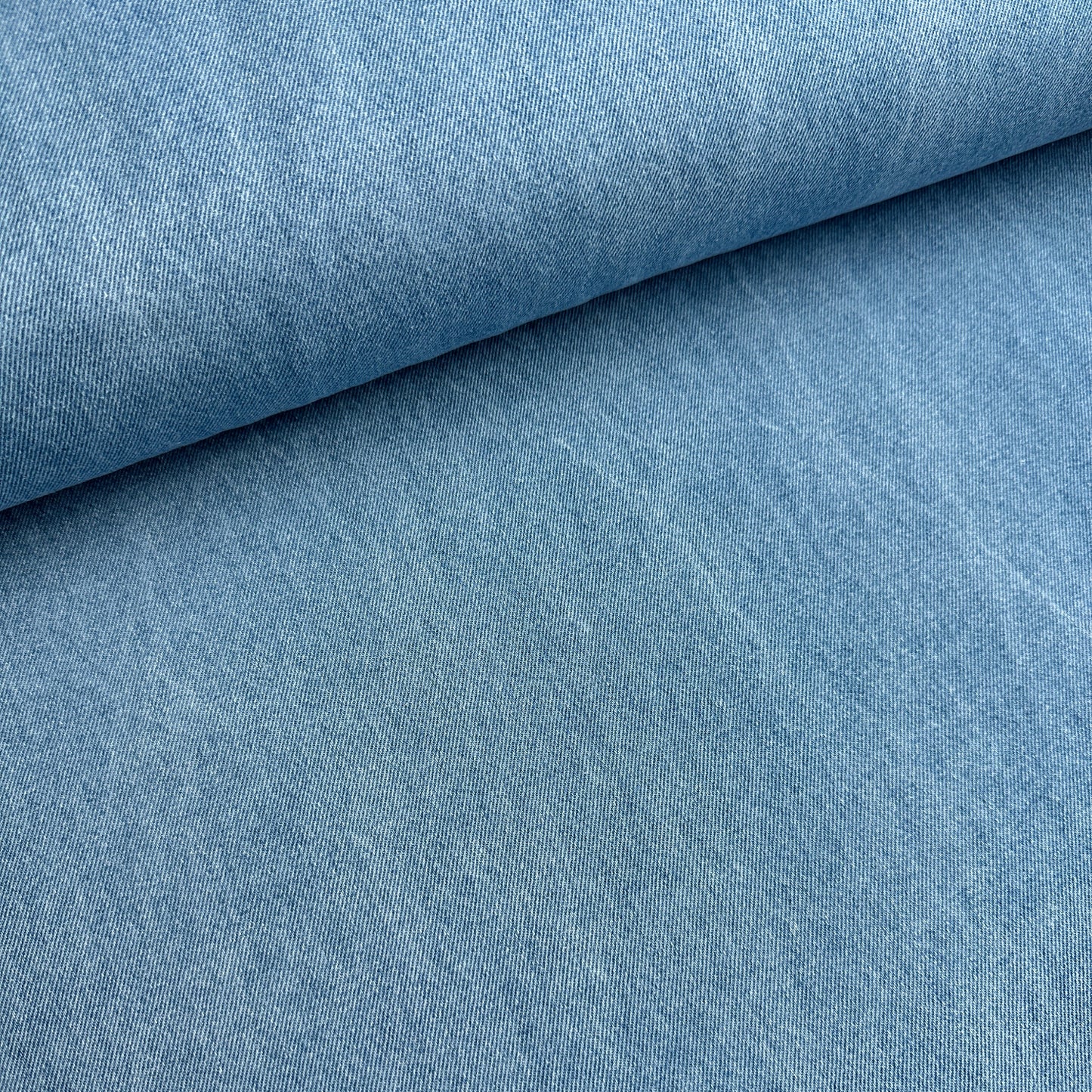 Blue distressed cotton denim fabric