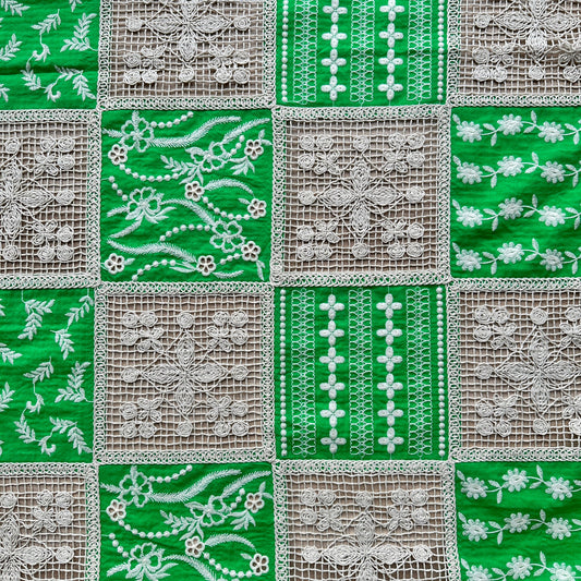 Green and white embroidered cotton patchwork fabric