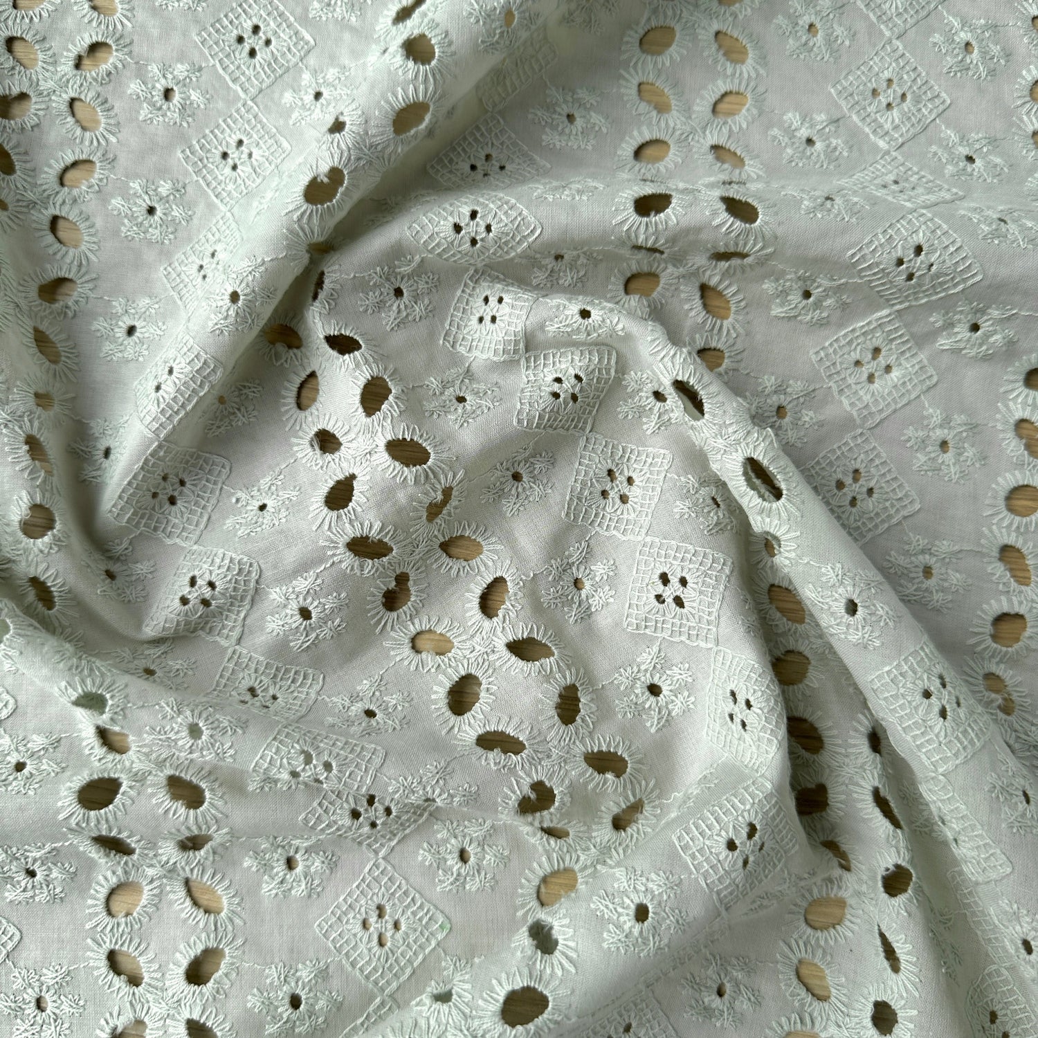 Embroidery anglaise fabric in light green