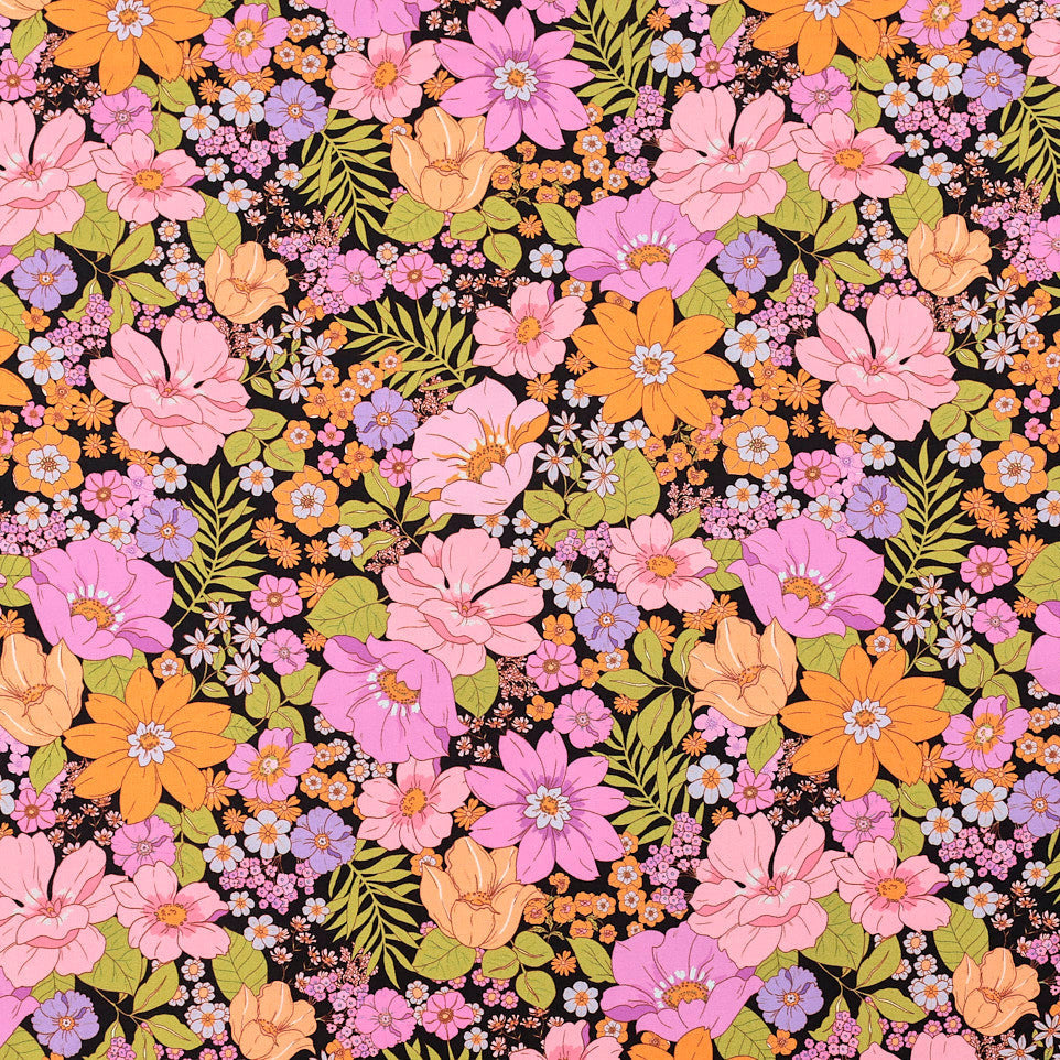 Colourful flowers across a black viscose linen fabric