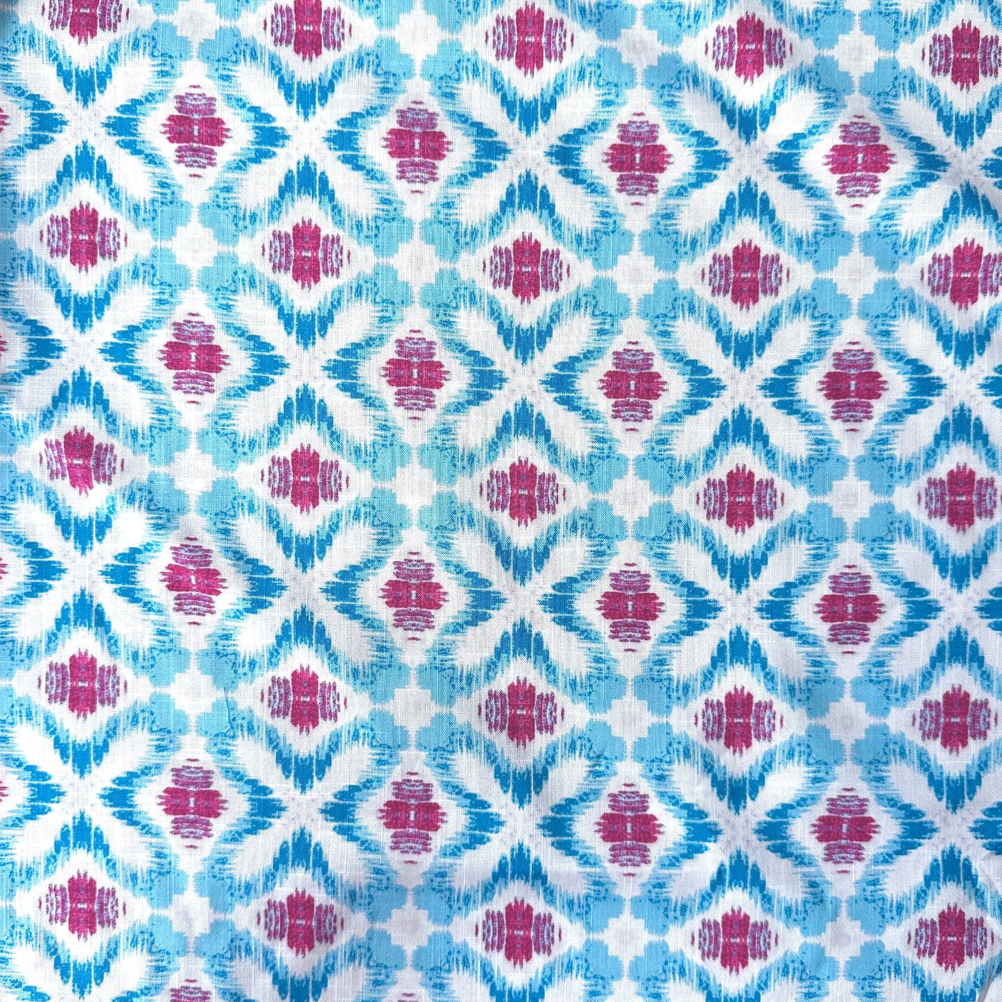 Geometric Ikat Cotton Linen Blend Fabric in Blue, Pink and White showing pattern