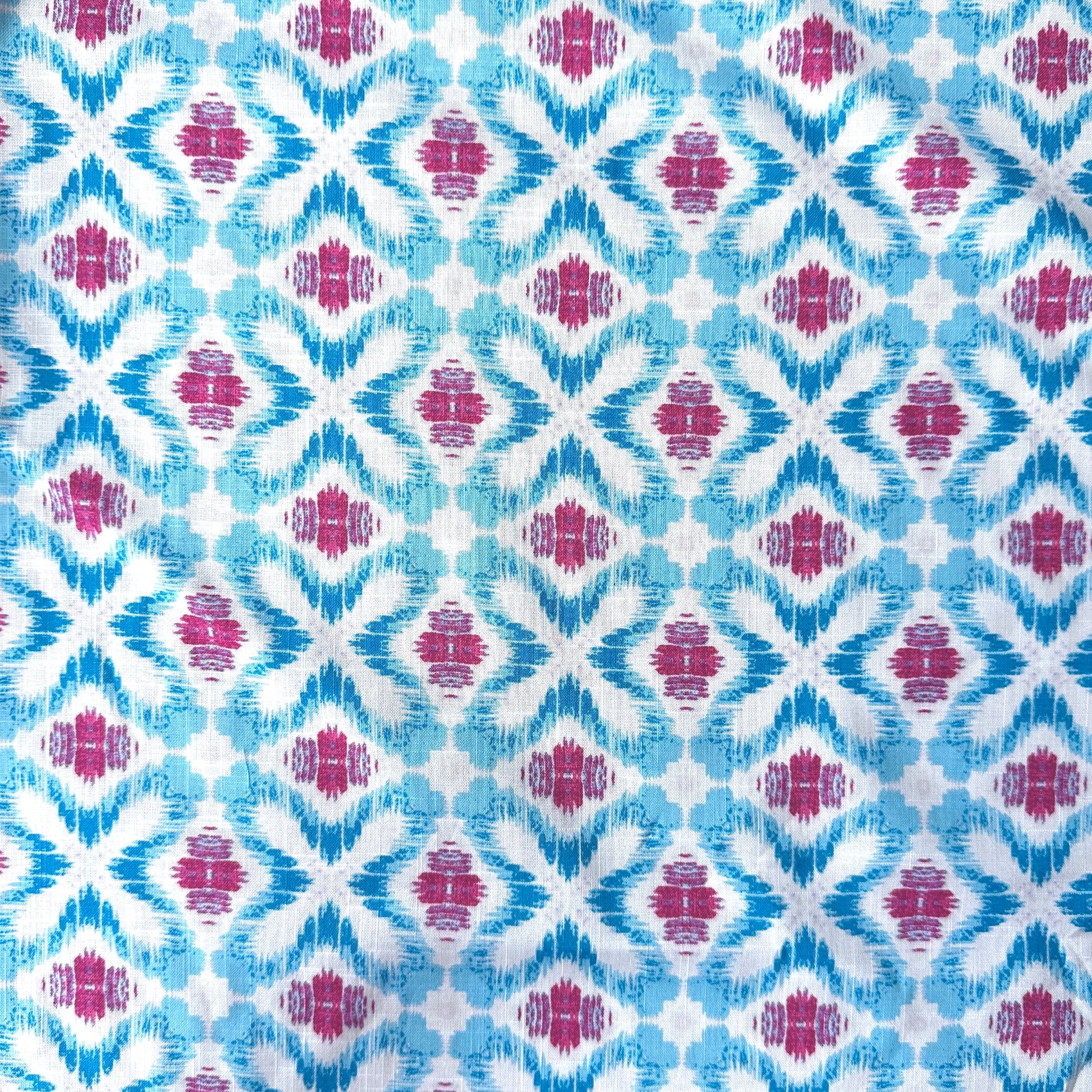 Geometric Ikat Cotton Linen Blend Fabric in Blue, Pink and White showing pattern