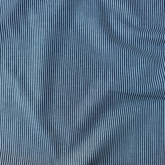 Close-up of a blue and white vertically striped denim fabric