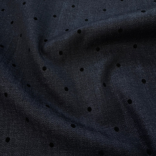 Dark indigo denim fabric with small black velvet dots