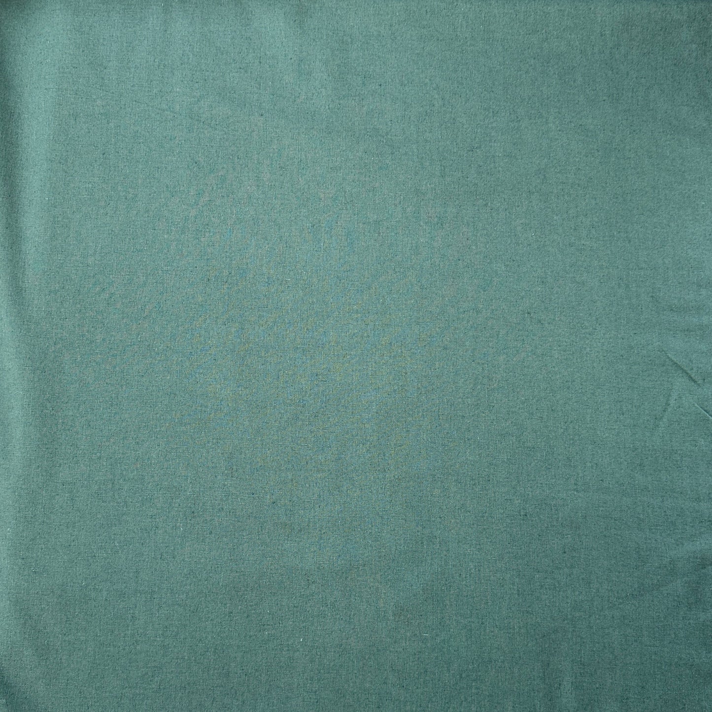 Sage green linen viscose fabric laid flat
