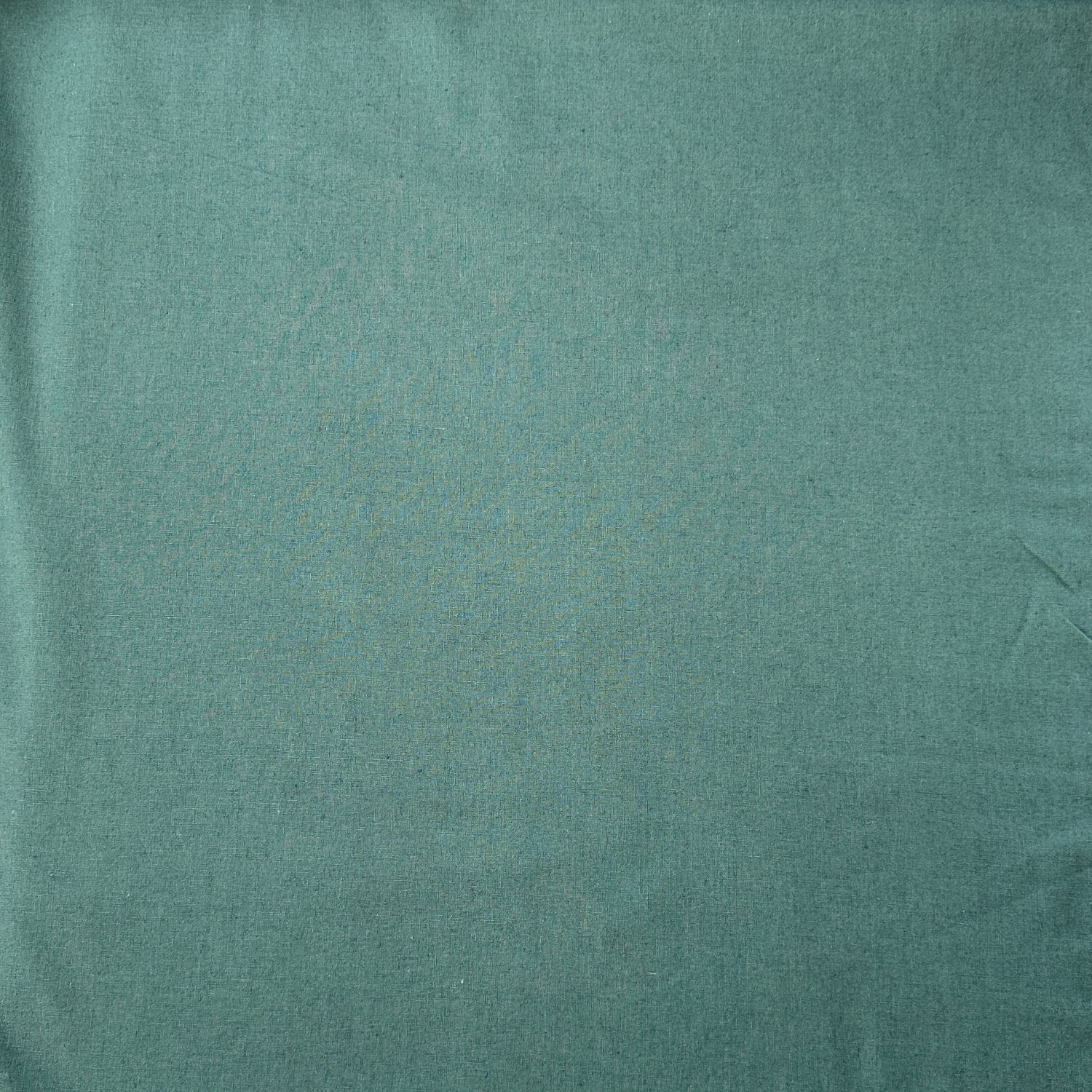 Sage green linen viscose fabric laid flat