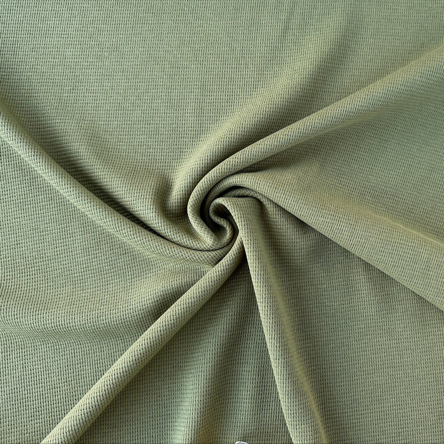 olive green waffle knit fabric swirled