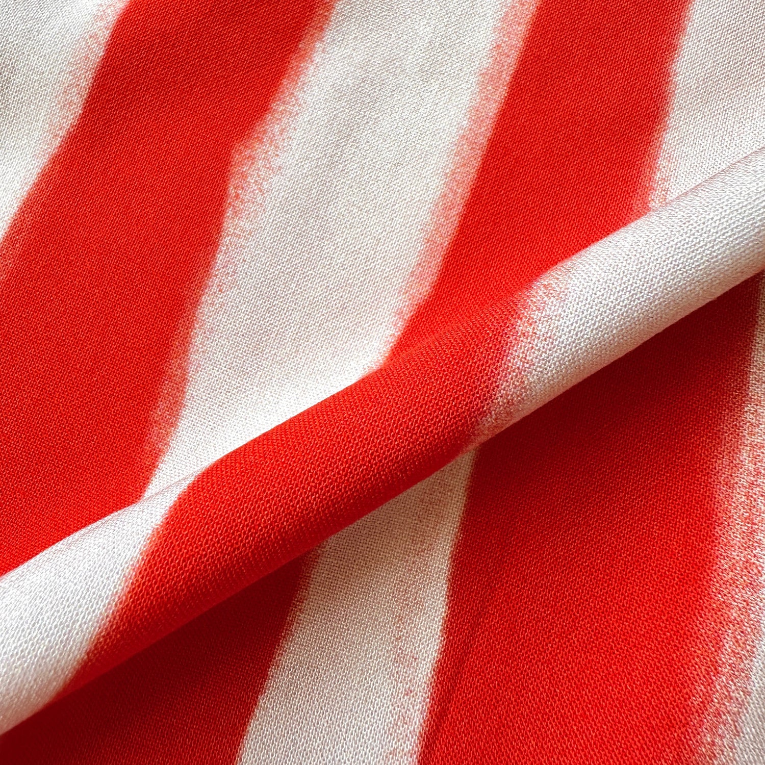 Close up of painted stripes viscose fabric