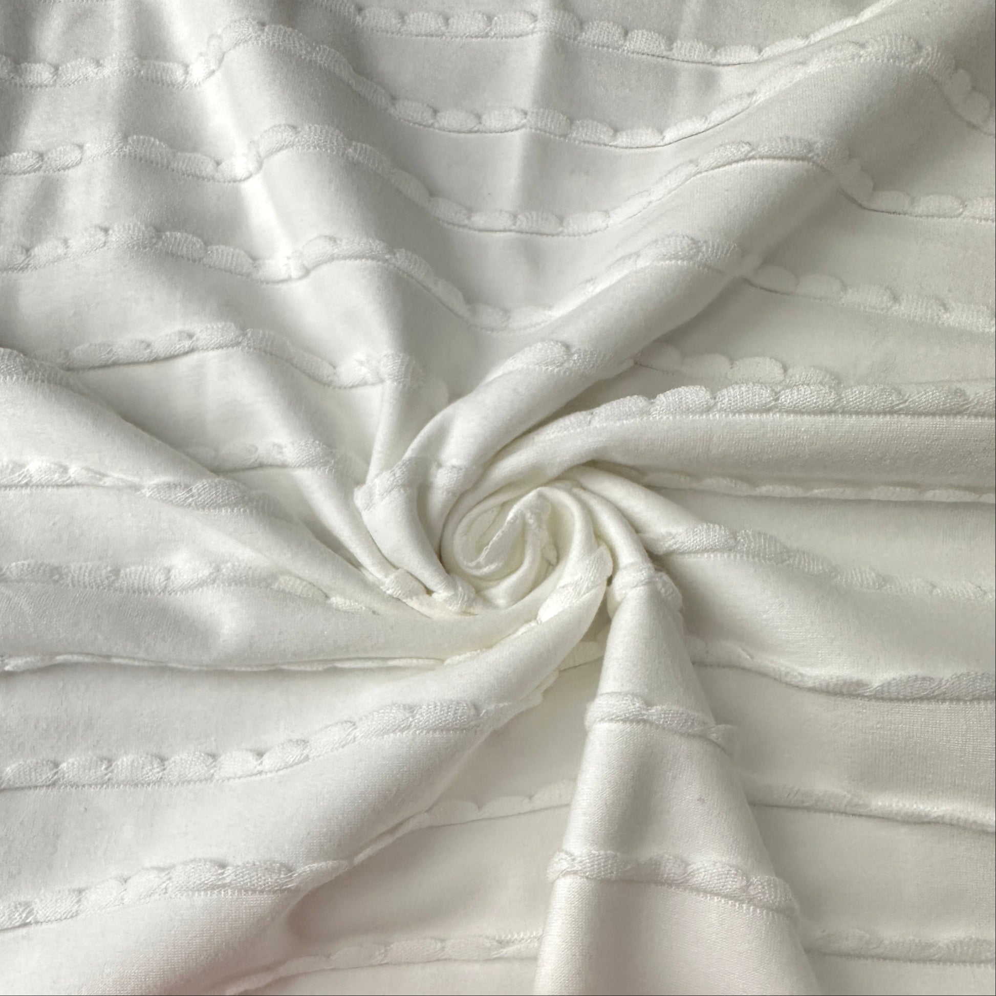 A Swirl of Ruffles Cotton Jersey Fabric in Off White