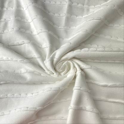 A Swirl of Ruffles Cotton Jersey Fabric in Off White