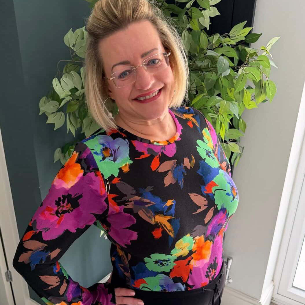Sarah wearing a Tammy Handmade Romy Top in the Colourful Flowers Viscose Jersey Fabric