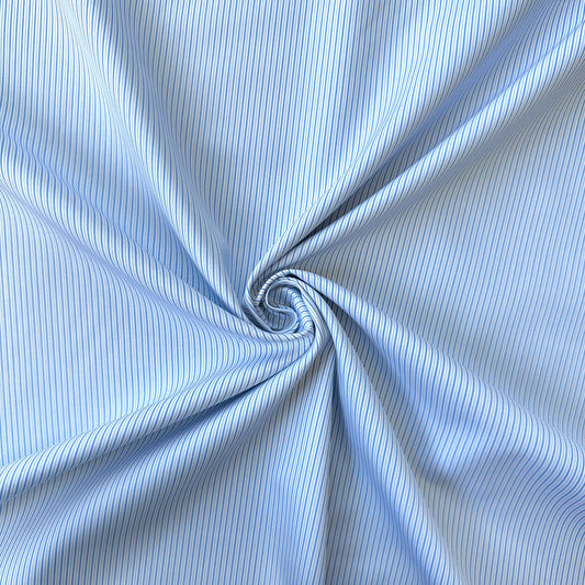 Close up of a swirl of blue striped cotton fabric
