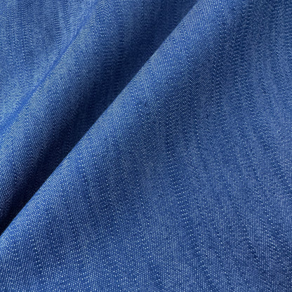 Close up of textured stretch denim chambray fabric