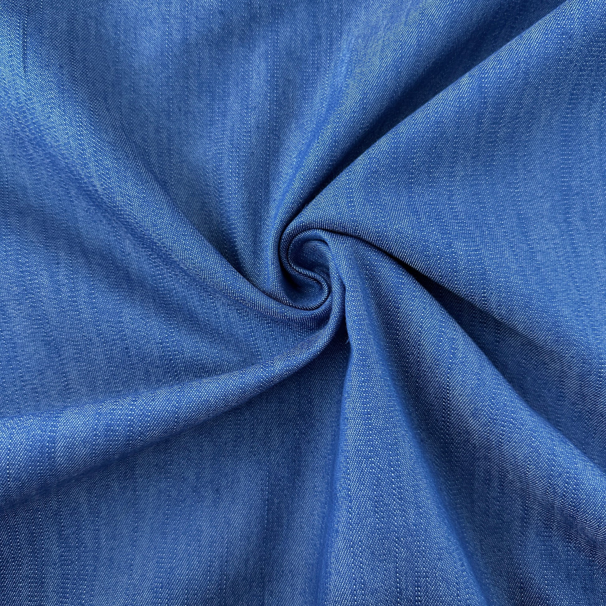 Close up of Textured Stretch Denim Chambray Fabric in Blue