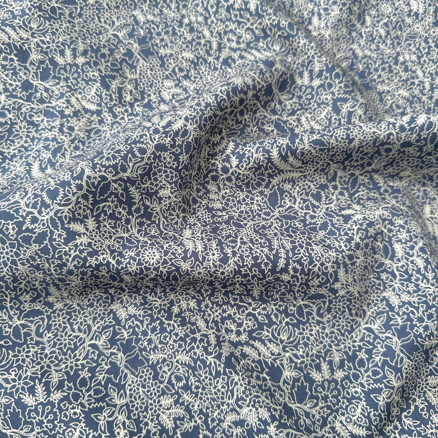 Floral patterned fabric with blue and white colors