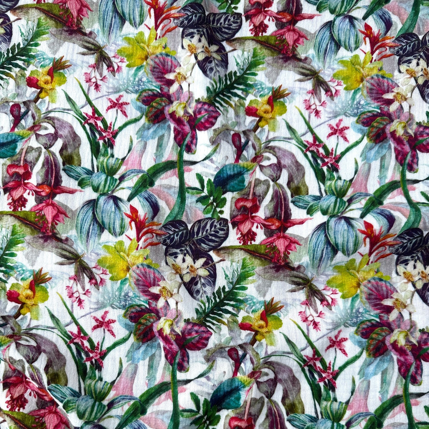 Colourful floral pattern on a white double gauze fabric