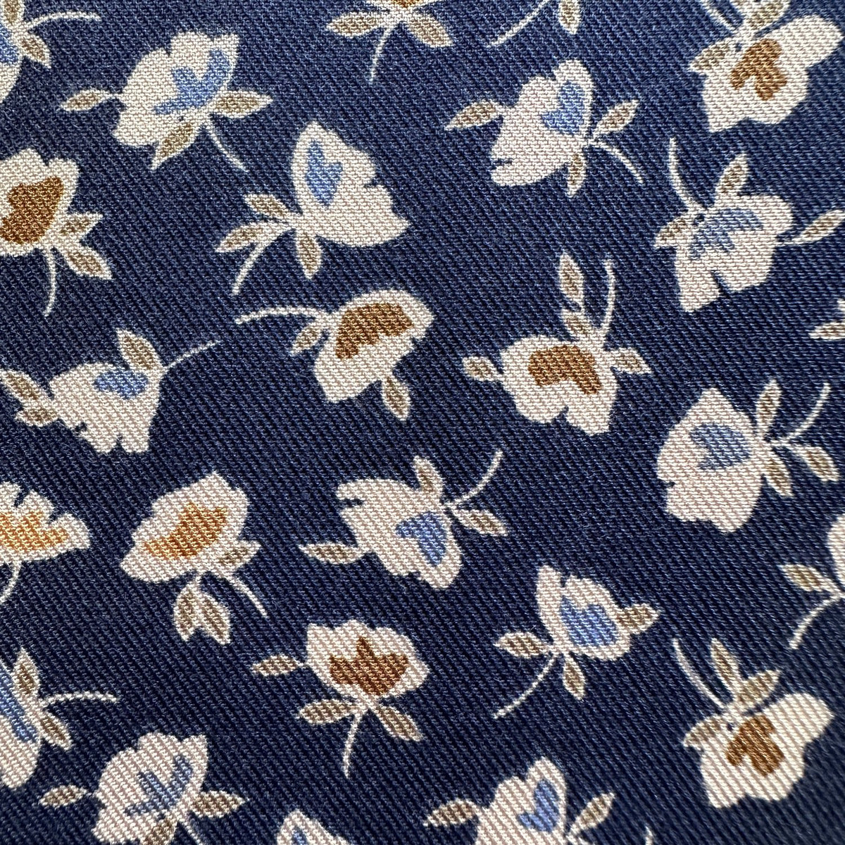 Close up of texture on floral viscose twill fabric